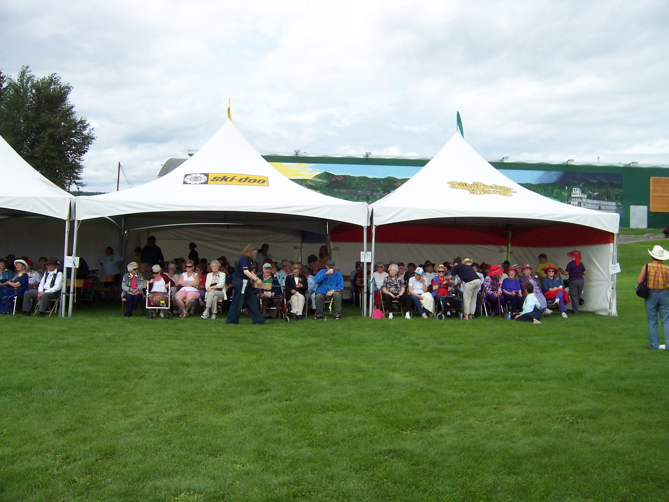 People enjoying the day in the tents at Seniors Day.
